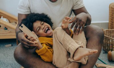 black father and son playing